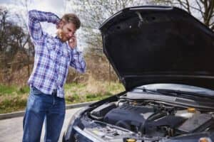 The man is having an issue with his car and getting problem with the long distance drive.